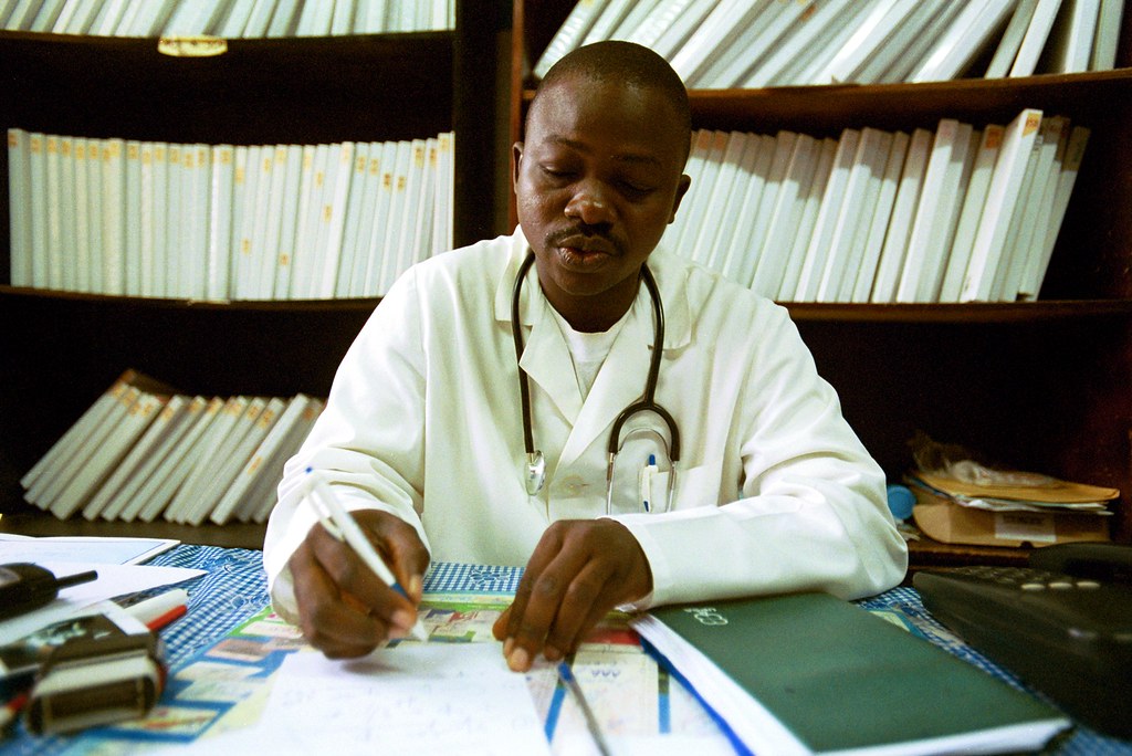 Image of doctor reading patient notes to illustrate virtual healthcare
