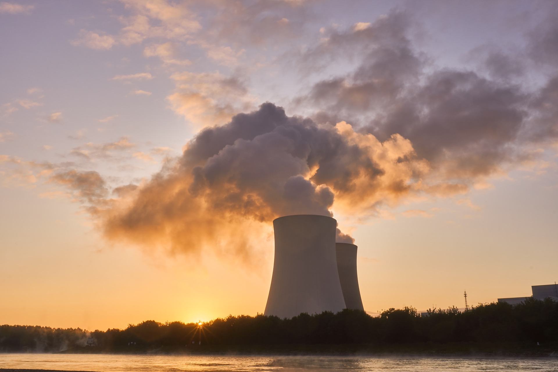 Nuclear power station cooling towers with smoke being releasesd