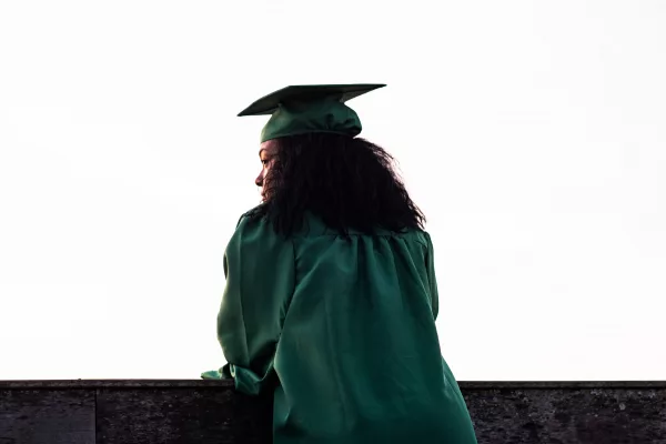 A woman in a graduation outfit