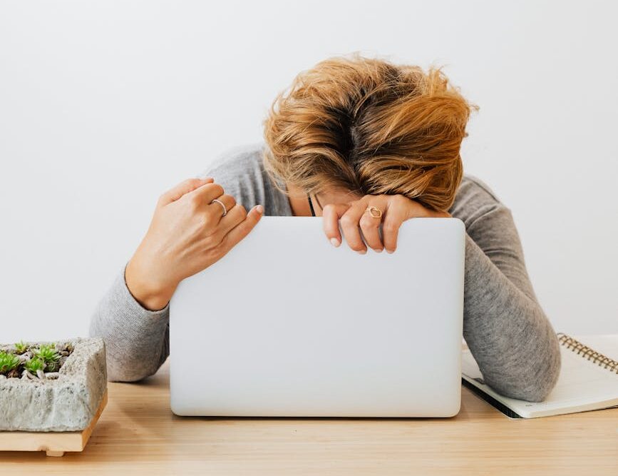 a woman holding a laptop