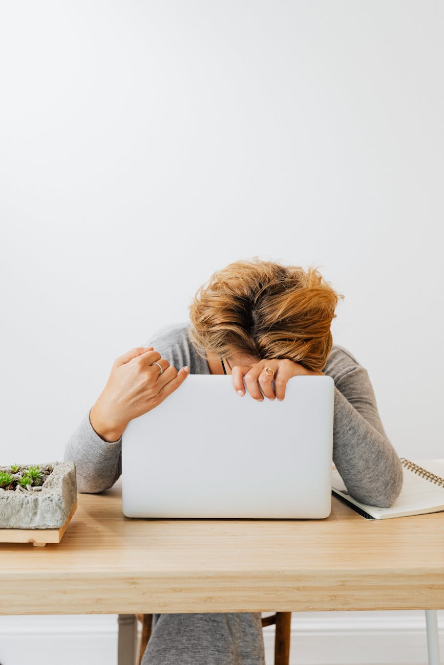 a woman holding a laptop